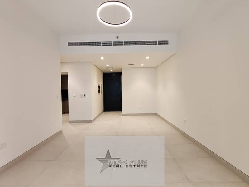 BRAND NEW SPACIOUS 1 BEDROOM APARTMENT WITH CLOSED KITCHEN,2 BALCONIES HAVING GYM,POOL AND COVERED PARKING.