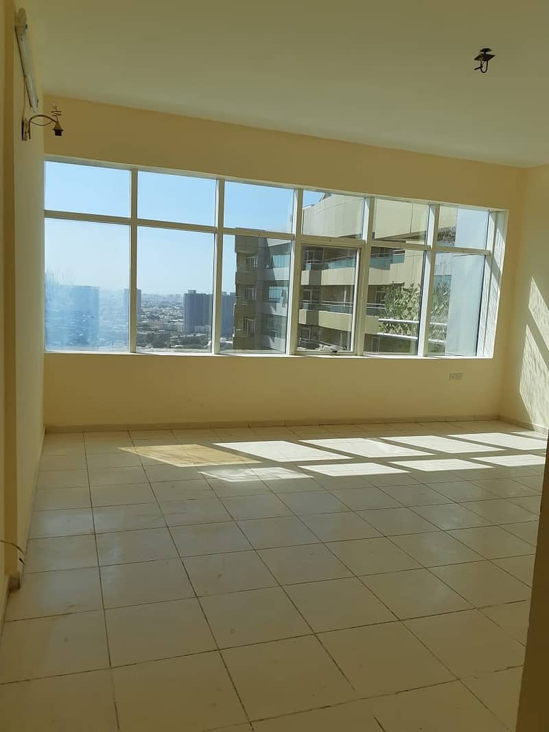 FOR RENT 1BHK WITH PARKING GARDEN VIEW IN HORIZON TOWER AJMAN 28000