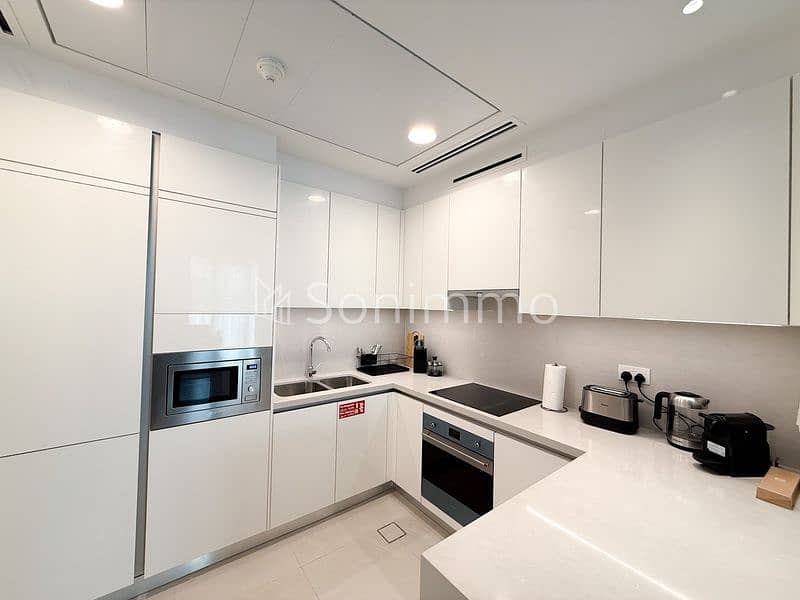 Furnished 2BR + Maid | Canal View | Prime Waterfront - Image 2