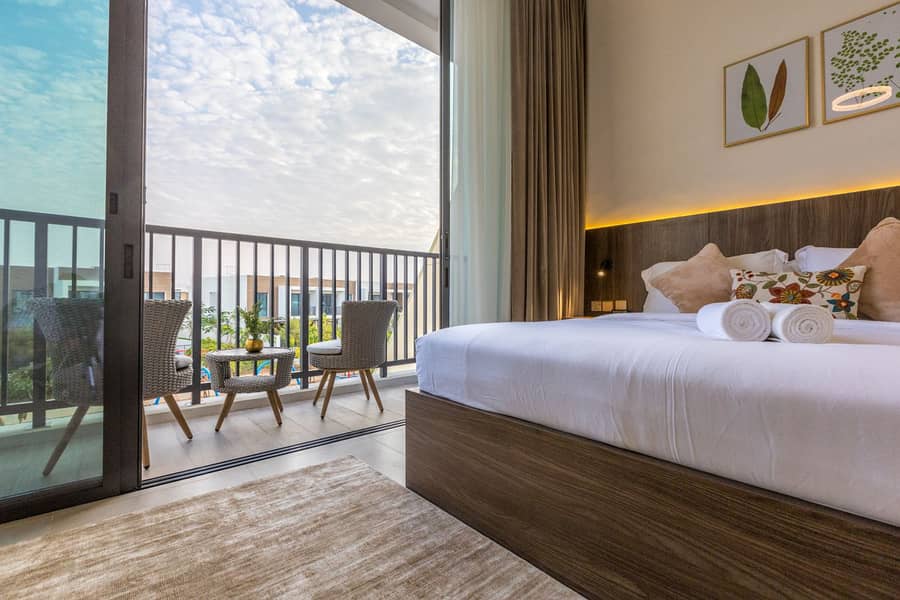 39 view from master bedroom with queen bed balcony . jpg
