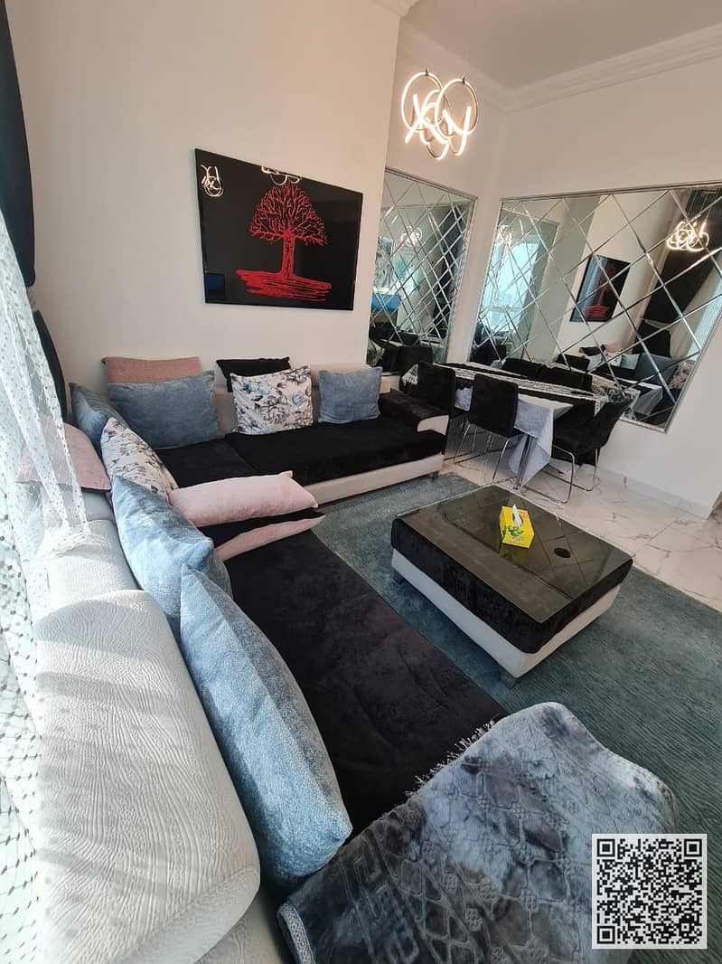 Fully furnished one-bedroom apartment with a hall, with open view, including all services, with a gym, swimming pool, and private parking.