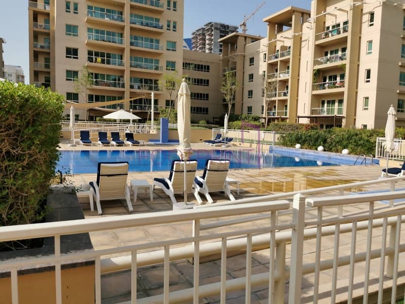 Lovely 1 bed |Community pool View |Semi Furnish