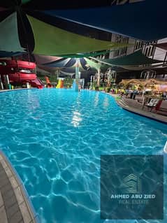 شقة غرفة وصالة للإيجار السنوي في عجمان مع جيم ومسبح واكوا بارك بناية فاخرة – خدمات متكاملة وشهر مجاني