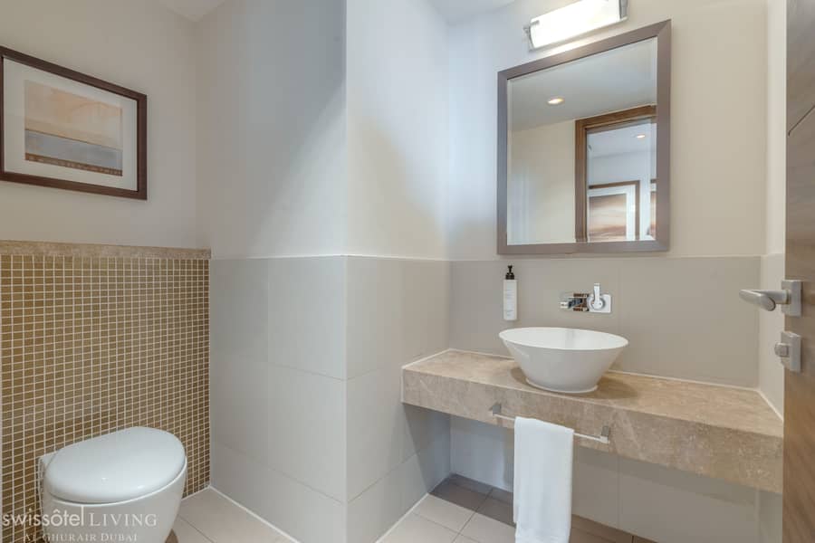 8 H1P9_2_bedroom_apartment_guest_bathroom. jpg