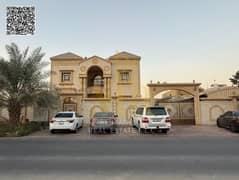 Large villa with an annex near Shurooq Mall on Sheikh Ammar Street. Large garden. Includes registration, electricity, and air conditioning. Freehold o