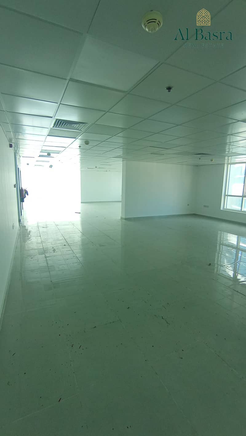 9 bright-office-with-large-windows-al-majaz-9. jpg