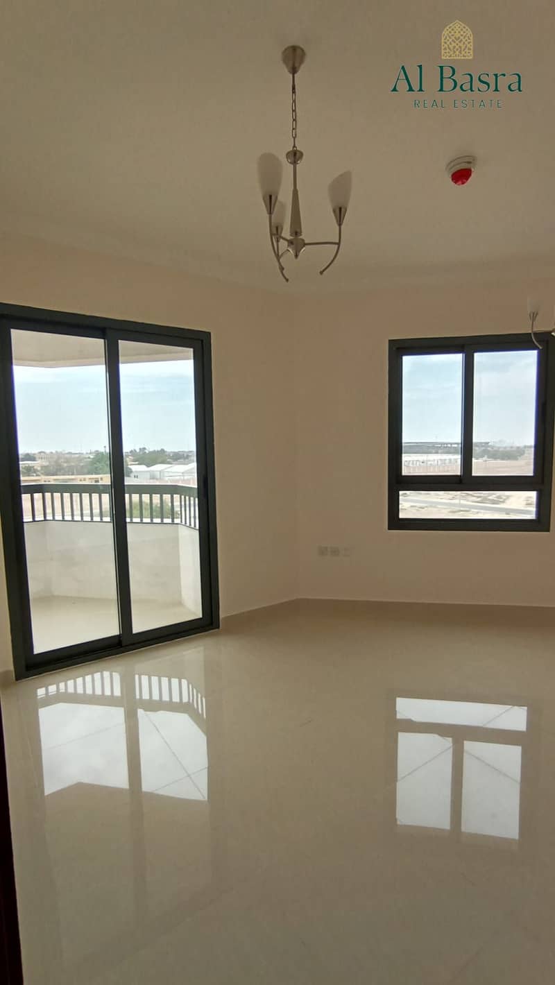 14 spacious-living-room-2br-apartment-al-zahia. jpeg