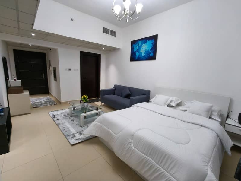 Furnished studio, first tenant in Yasmeen Towers Ajman, bills, internet and parking included.