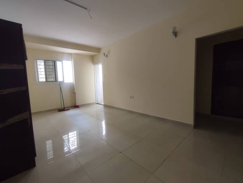 For annual rent, excellent location: one bedroom, living room, kitchen, two bathrooms, two balconies, and a laundry room in Rashidiya 2.