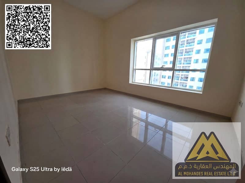 For annual rent: A two-bedroom apartment in Al Rashidiya - Pearl Towers, featuring a spacious layout and a prime location close to all services and am