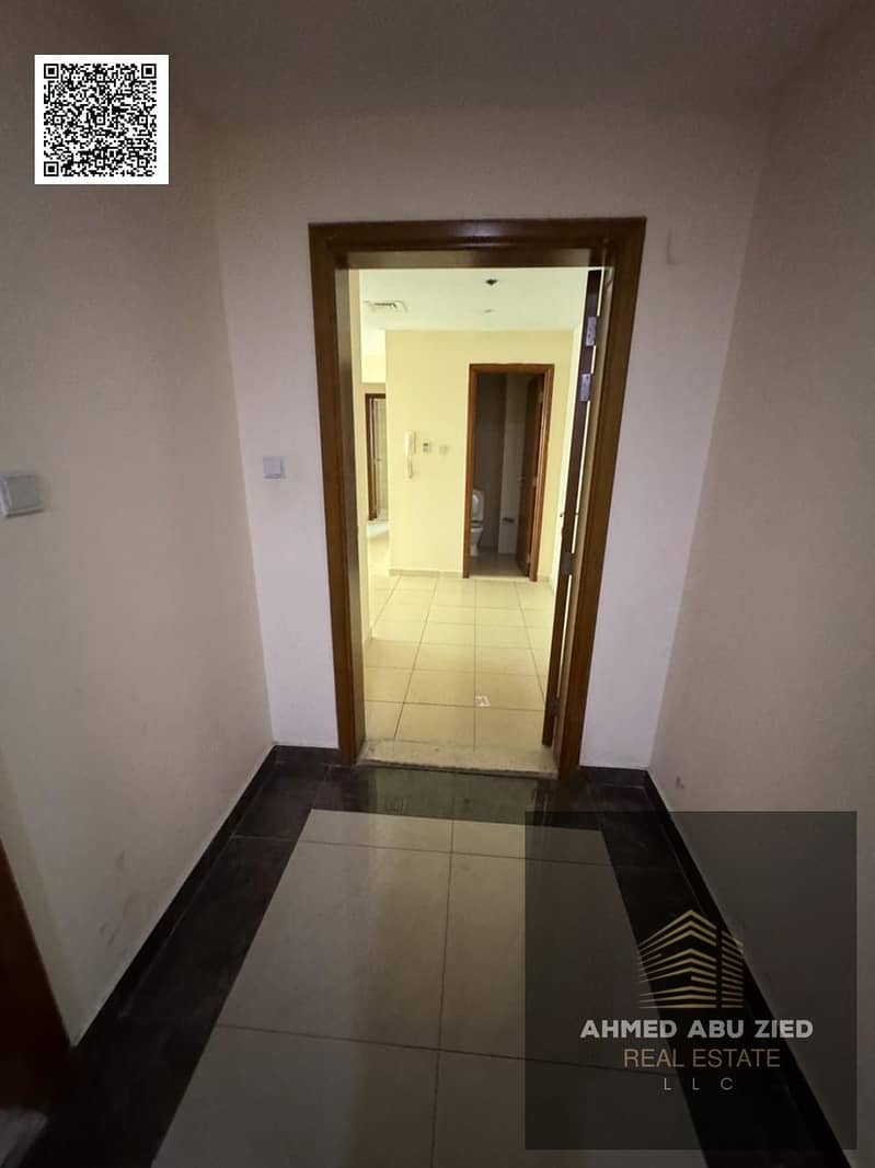 One bedroom and living room for annual rent in Ajman One Towers, Al Rashidiya 3, with sea view, balcony, and laundry room, inside a fully serviced tow