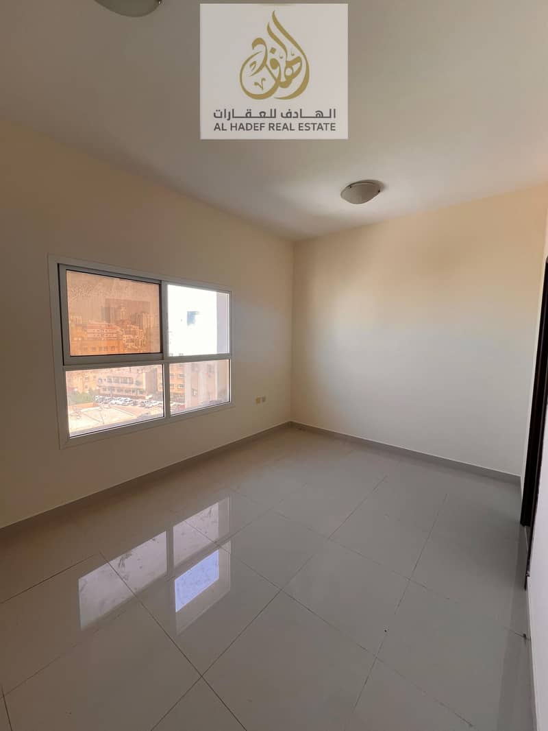 Annual rent in Ajman, Al Nuaimiya 3 area, next to Safeer Mall. The building is suitable for families. It features a studio apartment with a separate k