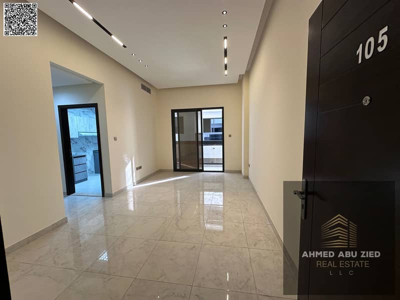 New 2BR hall apartment (first tenant) in Al Jurf with 1 month free. Master bedrooms, central AC, spacious layout, great finish, prime location.