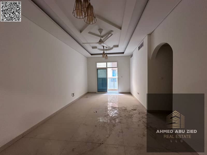 2BR hall apartment in Al Mowaihat 3, Ajman for annual rent with 1 month free. Wall closets, central AC, balcony, great price, easy payment plan.
