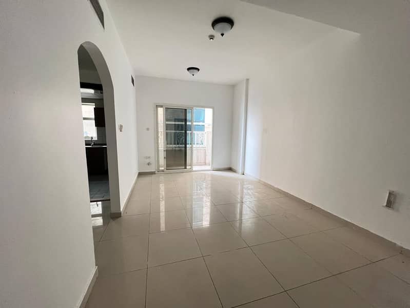 Beautiful 2-bedroom apartment with living room in Al Taawun, free parking, central AC, prime location, spacious layout, and close to Dubai exit.