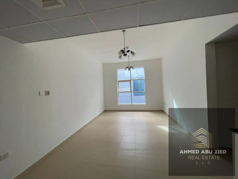 For annual rent: 2-bedroom apartment with living room in City Tower, Ajman. Prime location, spacious modern design, parking included, ready from owner