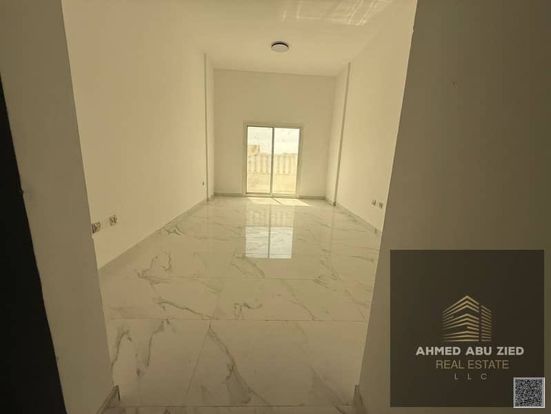 Very spacious 1 bedroom apartment for annual rent, 2 bathrooms, balcony with open view, central AC, first tenant, prime location, easy access to Dubai