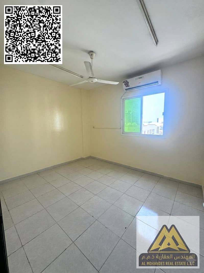 For annual rent: A two-bedroom apartment with a living room in Al Rawda 1, Ajman. Located in a prime location near the Dubai exit and adjacent to Al H