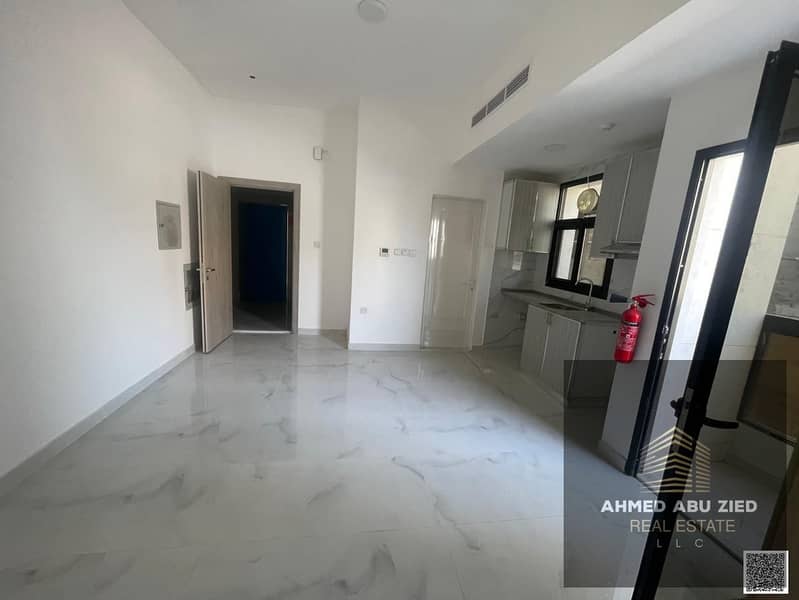 Spacious studio for annual rent in Ajman, balcony, central AC, vibrant area close to services, easy access to Sharjah and Dubai, flexible payments.