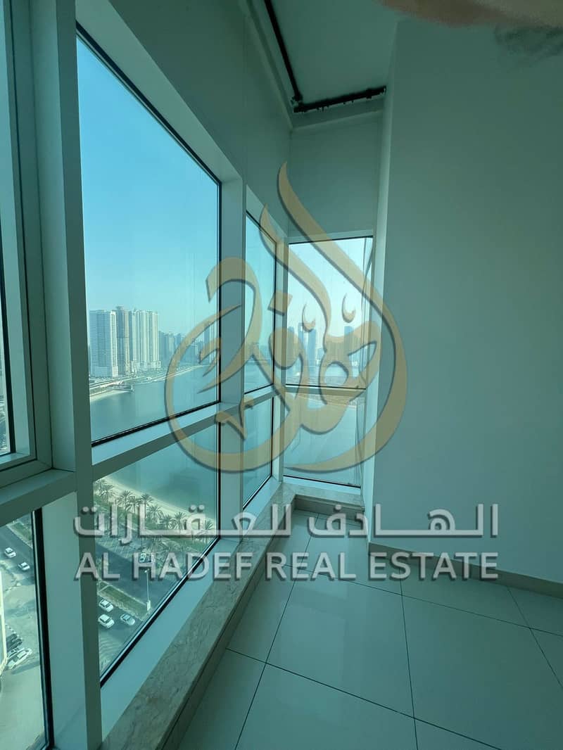 For annual rent in the Al Khan area of Sharjah A luxurious two-bedroom apartment with an elegant design and modern finishes, located in a distinguis