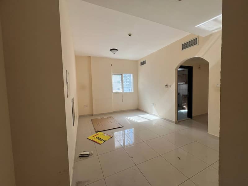 1BR apartment with living room, parking and 2 bathrooms in Al Taawun, Sharjah. Family building, prime location on Dubai exit, close to services.