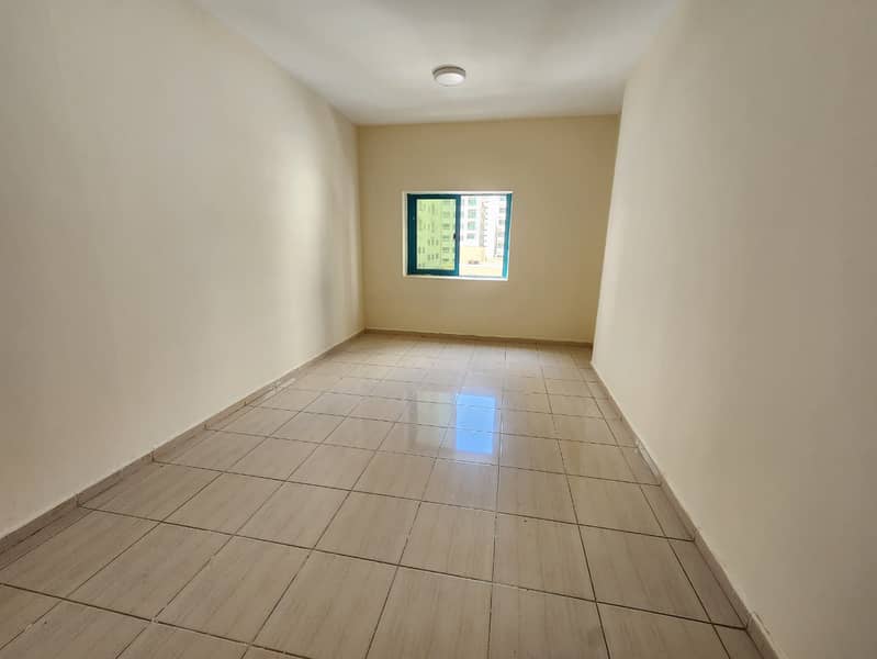 The cheapest two-bedroom apartment with a living room in Al Qasimia, with a balcony and an open view, close to daily services