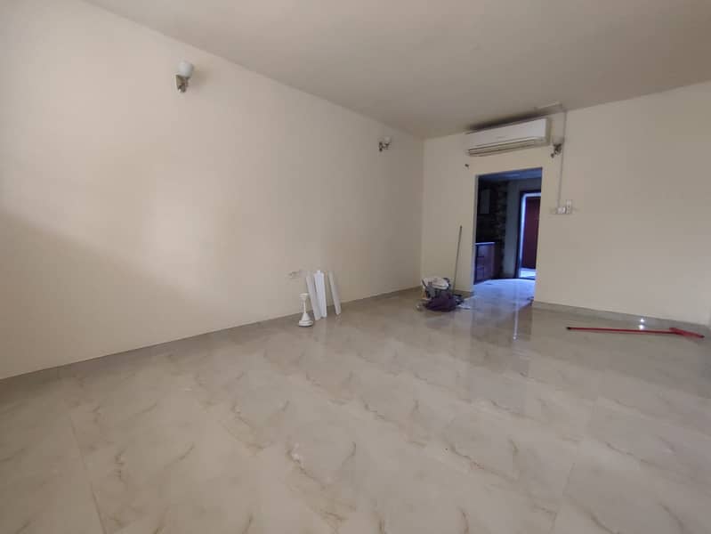Studio for rent in Al Rashidiya 2, Ajman, ground floor with a separate kitchen, clean family-only building with maintenance by the landlord, AED 21,00