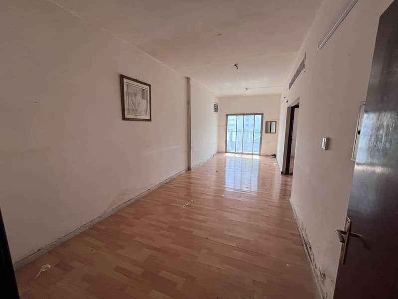 1-bedroom apartment for annual rent near Ajman Corniche, second row from the Corniche with balcony, excellent view and central AC, spacious and bright