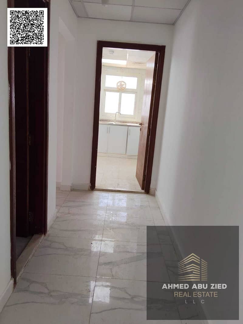 Two bedrooms and a living room for annual rent in Ajman, Emirates City | Master bedroom + living room | Balcony with an open view of Sheikh Mohammed B