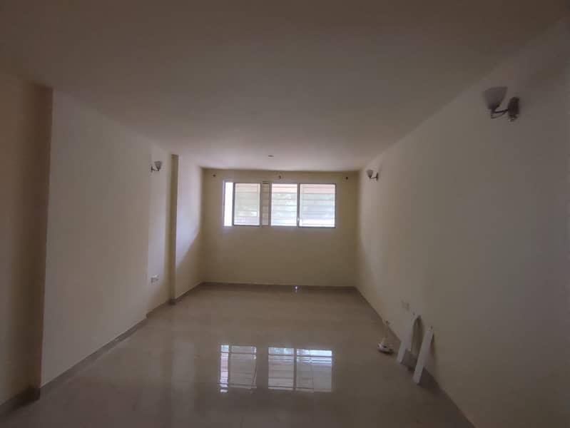 Studio apartment in Al Rashidiya, 2 separate kitchens, maintenance included, excellent location.