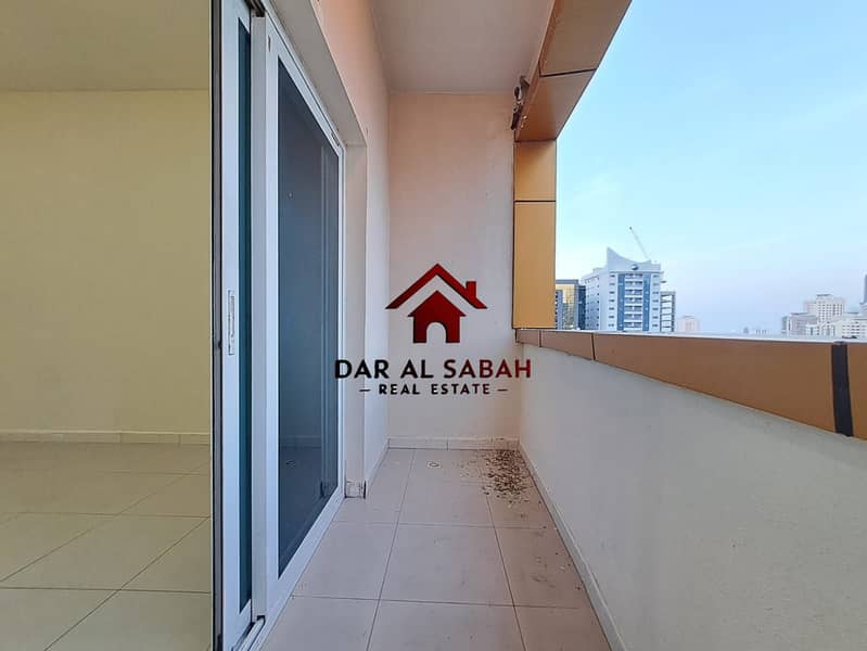 ONE MONTH FREE 1 BHK WITH BALCONY FRONT OF ALNAHDA PARK ONLY FOR FAMILY IN ALNAHDA SHARJAH