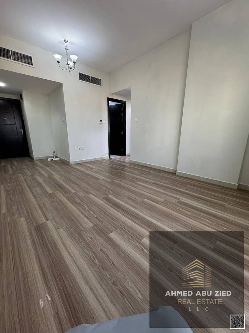 2-bedroom apartment for annual rent in Ajman, 2 bathrooms, central AC, ground balcony, parquet, covered parking, hotel finishing, near China Market.