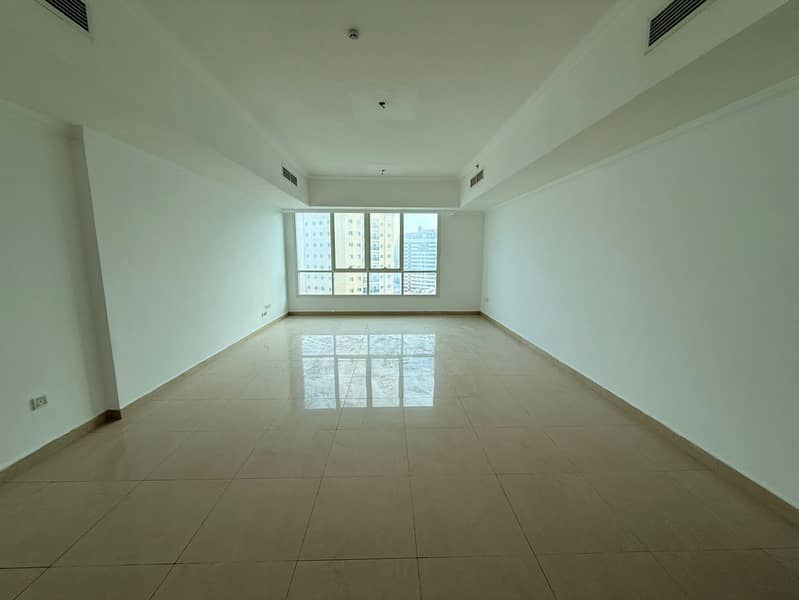 Spacious 2BR apartment in Al Majaz 2 with maid room, 4 bathrooms, central AC, open view in modern tower with free parking.