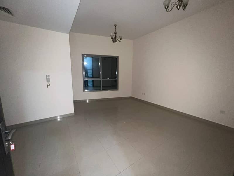 Largest 1BR apartment with living room in Al Taawun, spacious layout with free parking and flexible payment over 4 cheques.