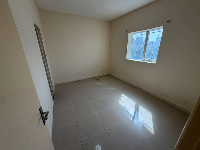 A fantastic opportunity for annual rent in Al Nuaimiya, Ajman, on Kuwait Street: a two-bedroom apartment with a living room in a vibrant location clos