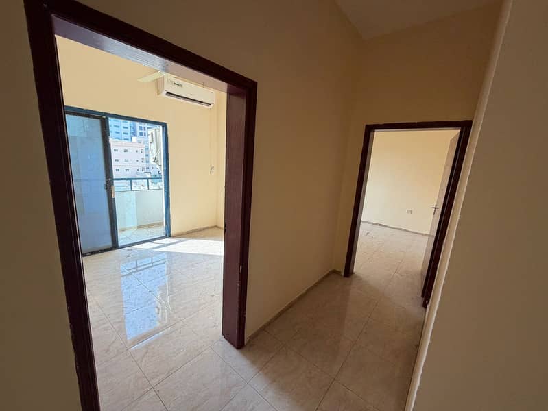 Two bedrooms and a living room, excellent Corniche view, with payment facilities, in the heart of Ajman, close to all services.