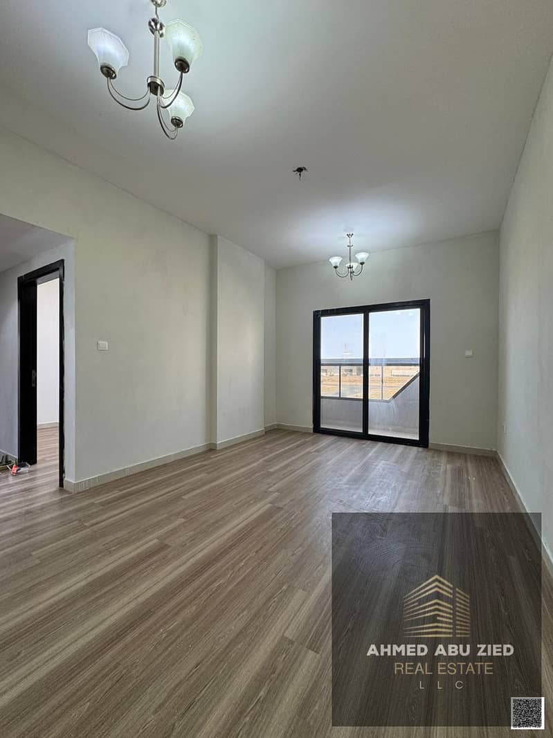 2-bedroom apartment for annual rent in Al Jurf Ajman, master room, spacious living hall, balcony, central AC, modern decor, clean quiet building, easy