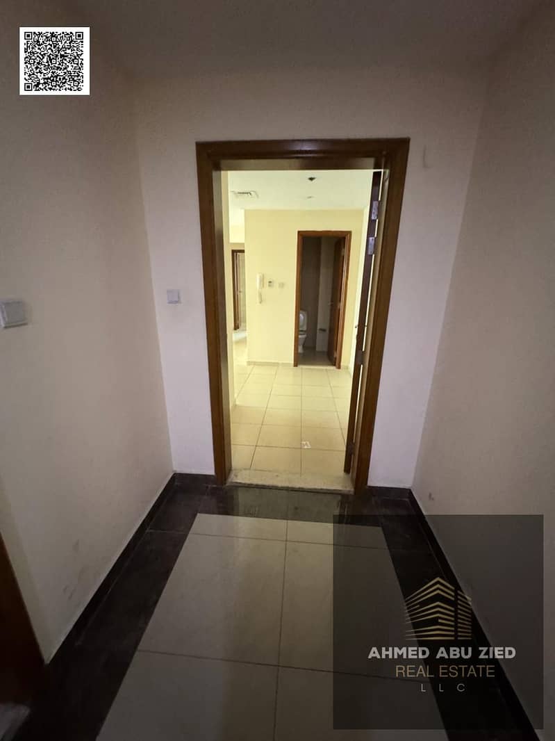 One-bedroom apartment for annual rent in Ajman One Towers, Al Rashidiya 3, with sea view, balcony, laundry room, gym, swimming pool, and garden inside