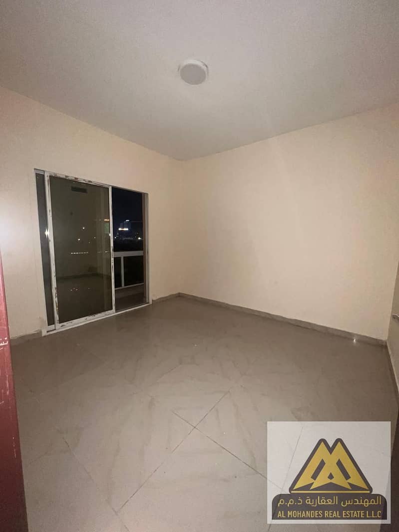 2-Bedroom Apartment with Living Room for Annual Rent in Al Nuaimiya 1, Ajman – Spacious Layout with Balcony and Central AC