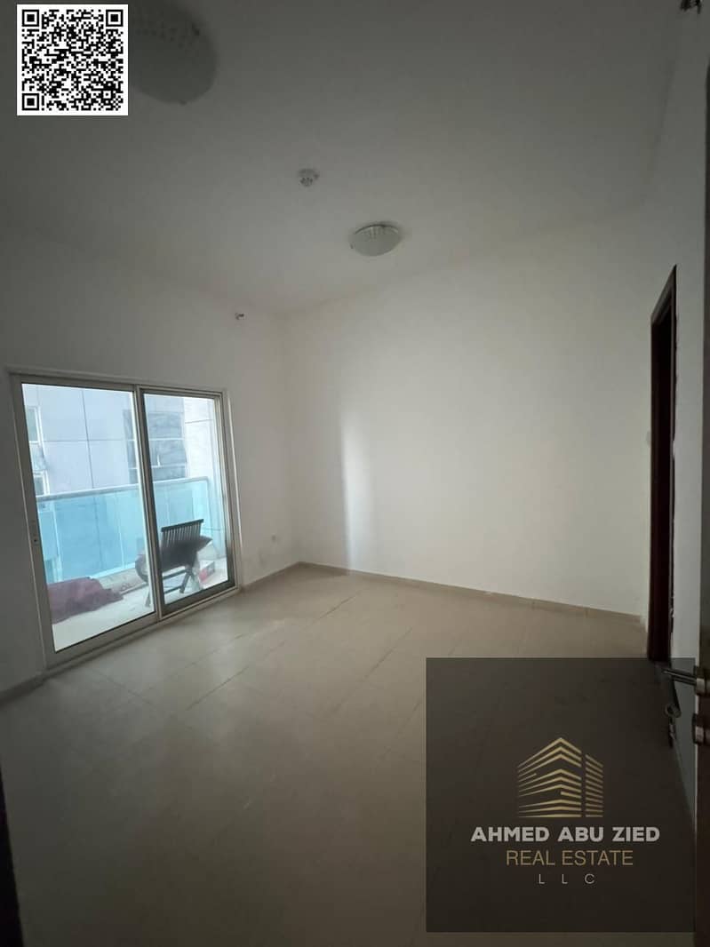 One-bedroom apartment with a balcony for annual rent in City Towers - Al Nuaimiya 3, Ajman, with free parking, close to all services and schools.