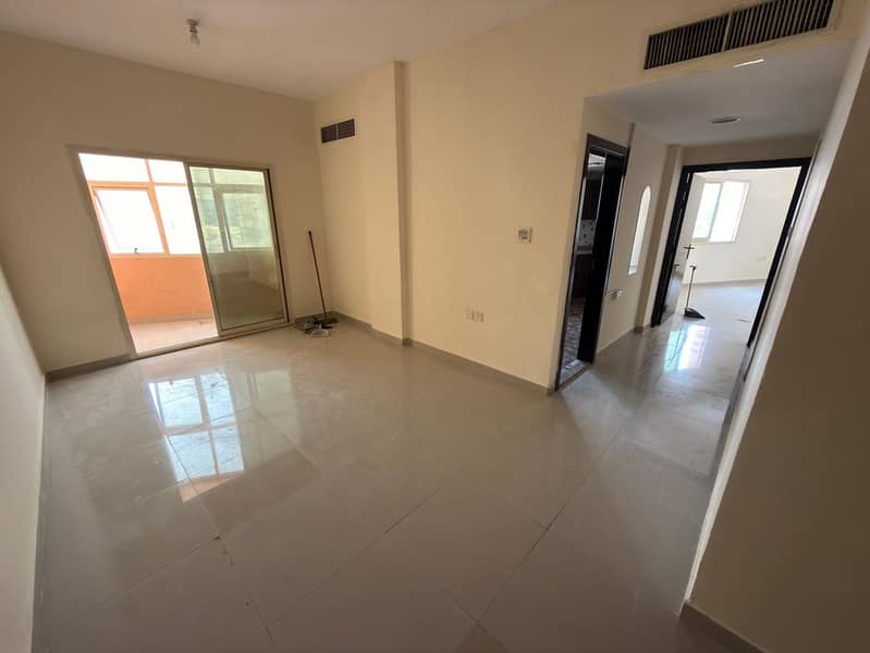 One-bedroom apartment for annual rent in Al Jurf 2, Ajman, on the main road in a prime location opposite Al Rawda Bridge and near Nesto and Emirates