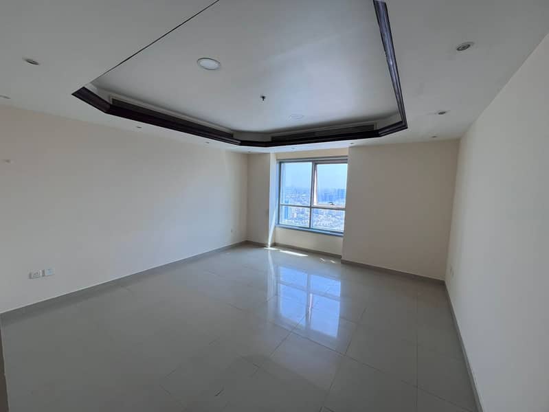 One bedroom and living room - annual rent, Corniche Towers, Ajman - central air conditioning - maintenance included.