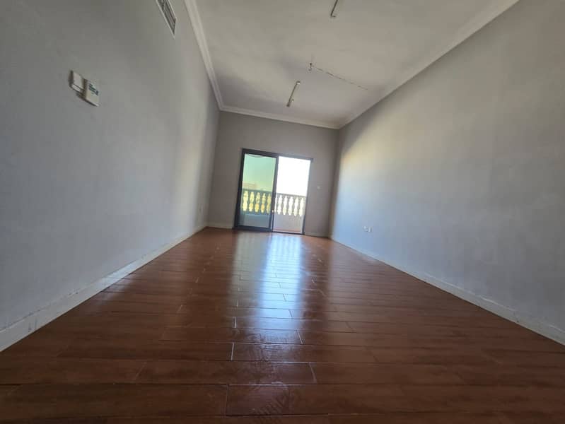 One-bedroom apartment with hall for annual rent in Al Naeemia, Ajman, near Ramez Mall, 2 bathrooms, balcony, parquet flooring, 29,000 AED in 4 install