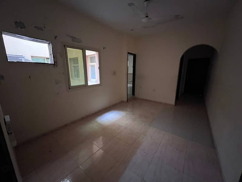 One bedroom and living room for annual rent in Al Rawda 3, Ajman 24,000 AED in 6 installments Directly on Sheikh Ammar Street Without air conditioning