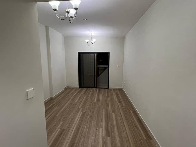 2BR + hall in Al Jurf 3 Ajman near China Market & Ajman Festival, 2 baths, balcony, central AC, free parking. Rent AED 41,000 in 6 payments.