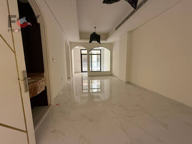 Two rooms and a living room for annual rent in Tila 2 area. One month free. Majlis. 3 bathrooms. Balcony. Wall cabinets. Swimming pool and Jacuzzi.