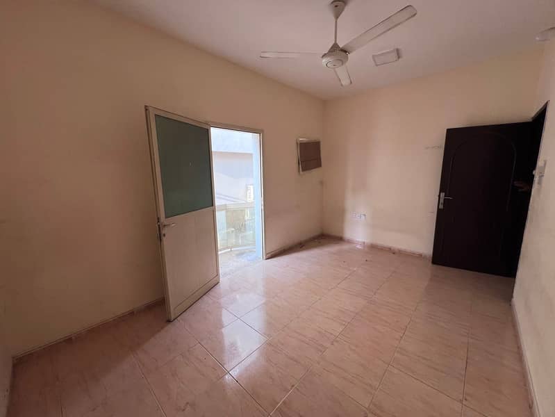 For annual rent: A one-bedroom apartment in Rawda 3, unfurnished, in a prime location directly on Sheikh Ammar Street, close to all essential services