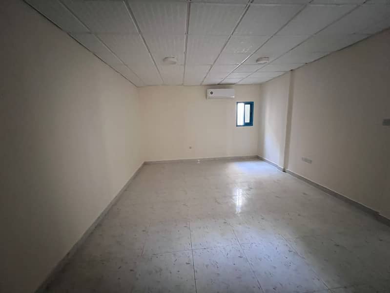 One-bedroom apartment with hall for annual rent in Al Nuaimiya, Ajman, near Al Hikma School and Ramada Hotel, split AC, 25,000 AED, flexible installme