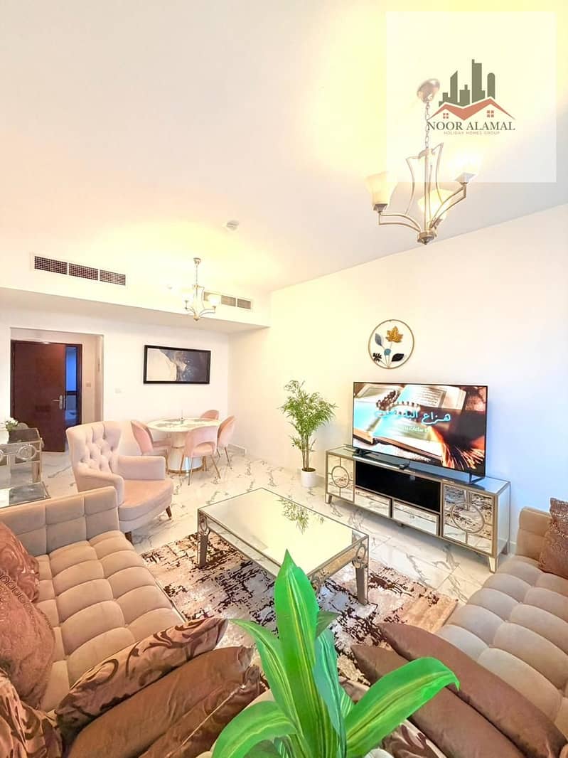 Sharjah, Al Khan, Beach Tower 1, furnished apartment with hotel-style furnishings, second occupancy, three bedrooms, living room, maid's room, kitchen