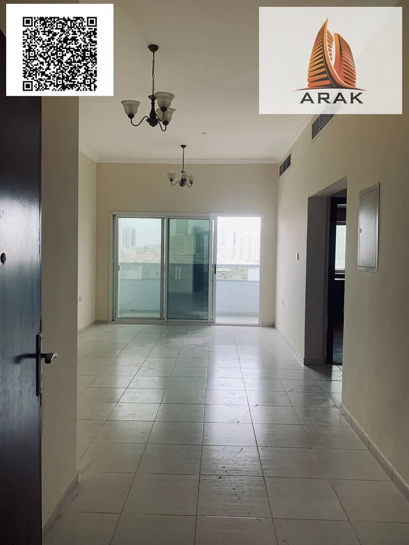 A well-maintained apartment is available for annual rent in Al Bustan, Ajman, located in the same building as Al Shareef Building, in a lively area c